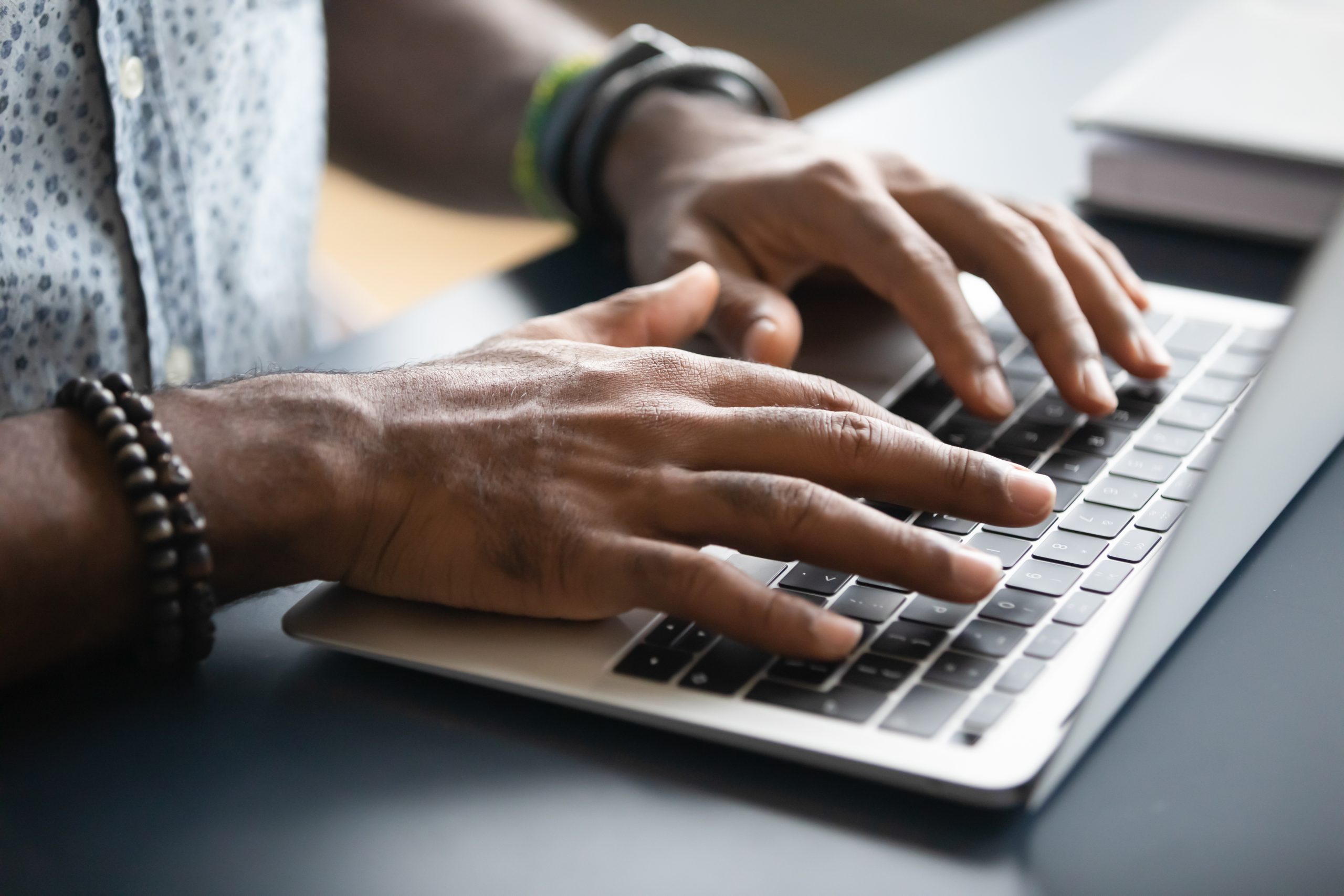 hands Hands on a laptop keyboard